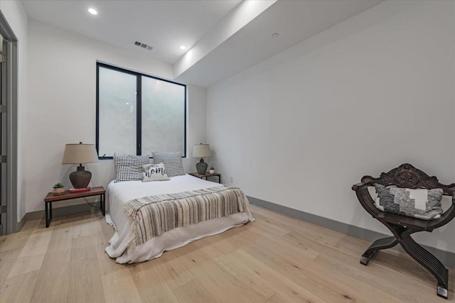 bedroom with light hardwood / wood-style flooring