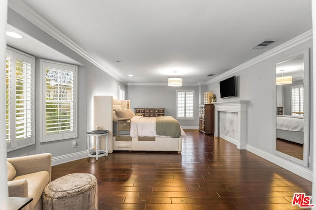 bedroom with crown molding and dark hardwood / wood-style floors