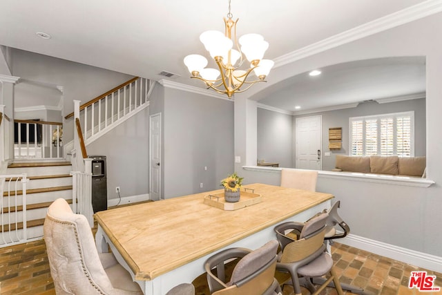 dining room featuring an inviting chandelier and ornamental molding