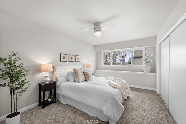 bedroom featuring ceiling fan, a closet, and carpet