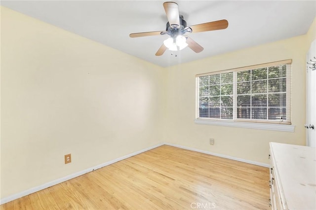 unfurnished room with ceiling fan and light wood-type flooring