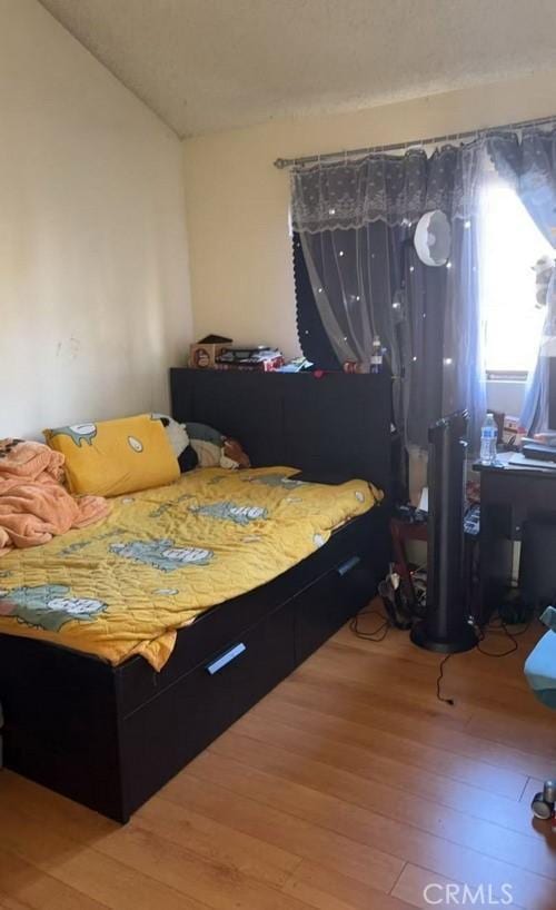 bedroom featuring hardwood / wood-style floors