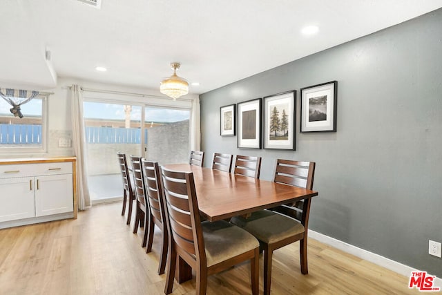 dining area with light wood-type flooring