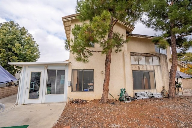 rear view of house with a patio