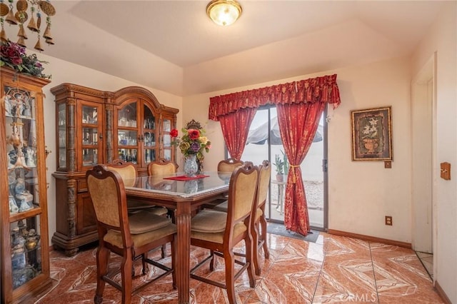 dining space featuring a tray ceiling