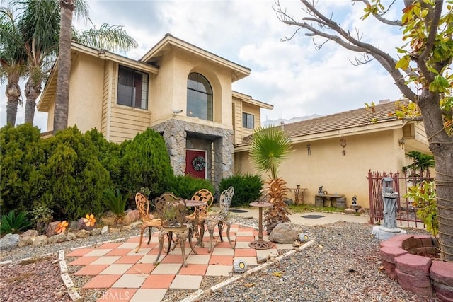 back of property featuring a patio area