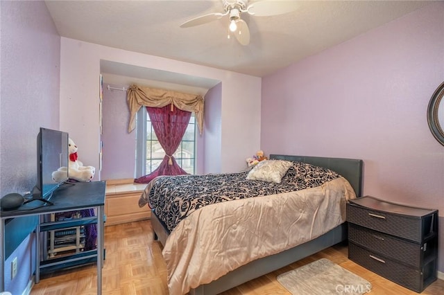 bedroom featuring light parquet floors and ceiling fan