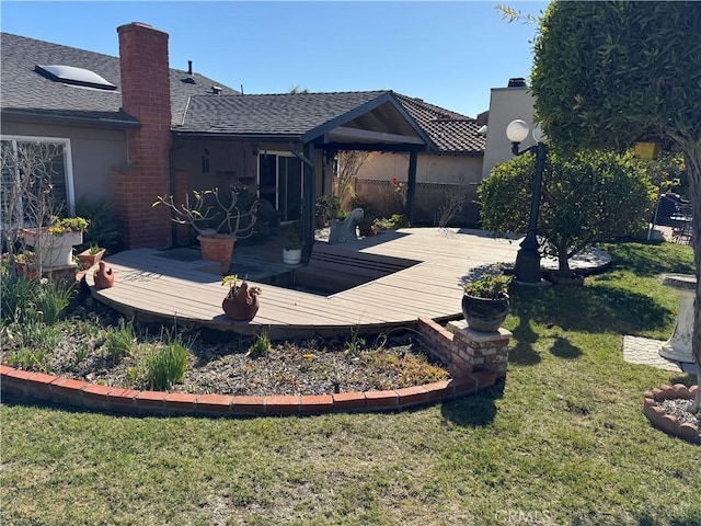 deck featuring a lawn