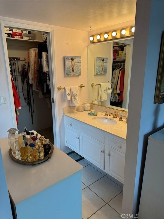 bathroom featuring vanity and tile patterned flooring