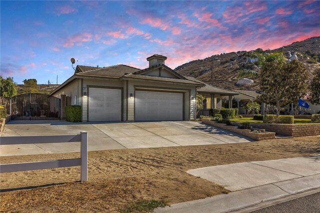 view of front of property featuring a mountain view and a garage