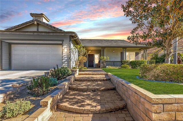 single story home featuring a garage