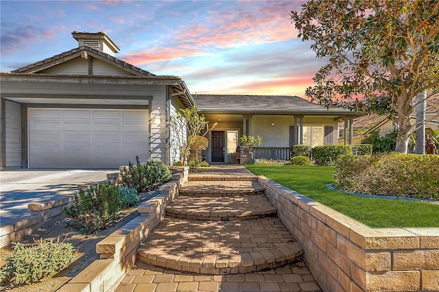 ranch-style house featuring a garage and concrete driveway