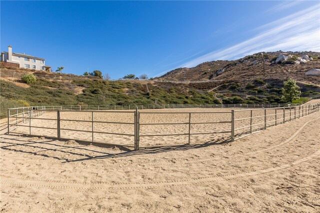 view of yard featuring a mountain view and a rural view