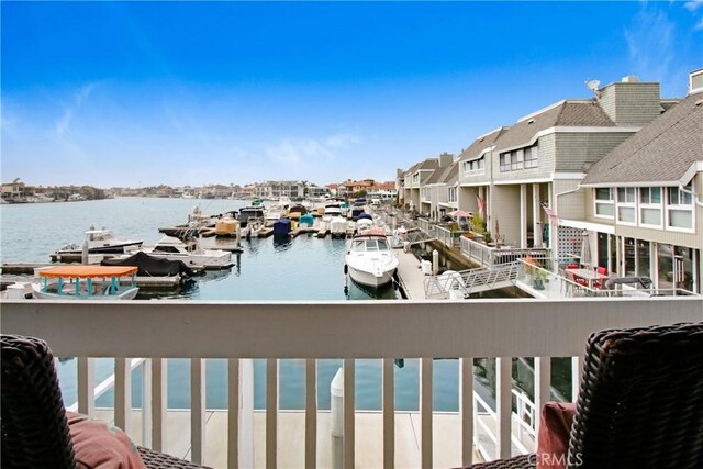 balcony featuring a water view