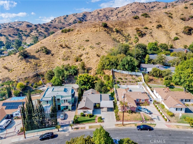 birds eye view of property featuring a mountain view