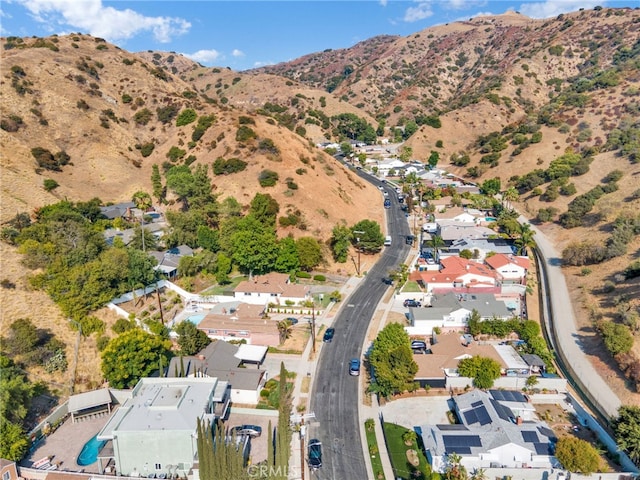 birds eye view of property with a mountain view