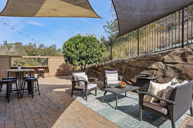 view of patio / terrace featuring an outdoor bar