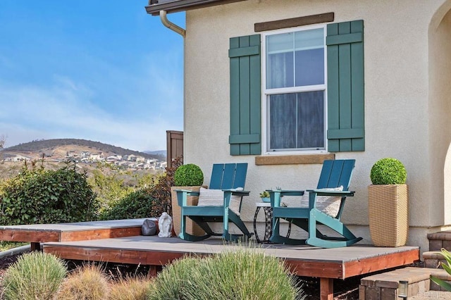 view of patio featuring a deck with mountain view