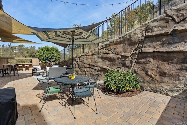 view of patio featuring a bar and area for grilling