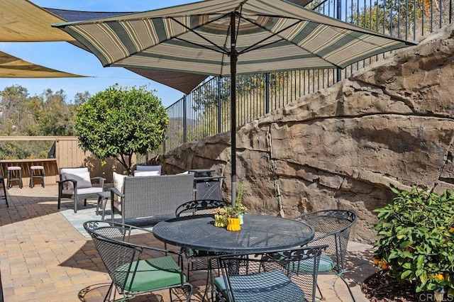 view of patio featuring outdoor lounge area and an outdoor bar