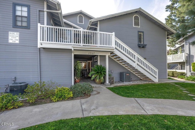 exterior space featuring stairway and central AC unit