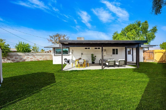 rear view of house with a yard, outdoor lounge area, and a patio area