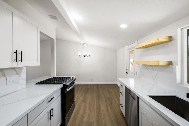 kitchen with pendant lighting, light stone counters, white cabinets, range with gas cooktop, and stainless steel dishwasher