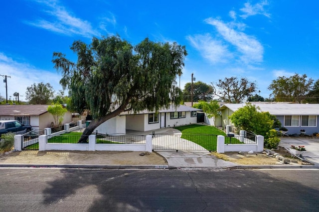 ranch-style house featuring a front lawn