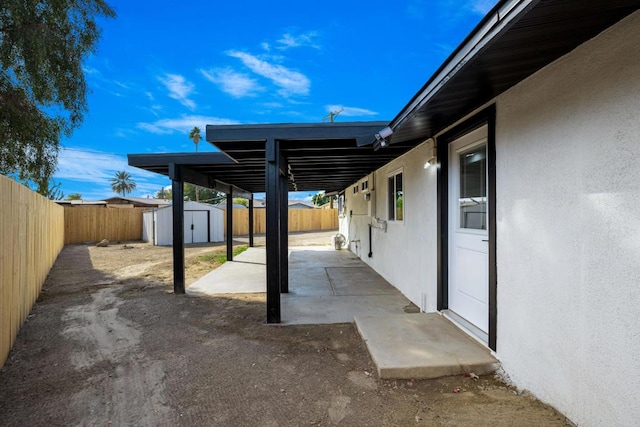 view of patio / terrace with a shed