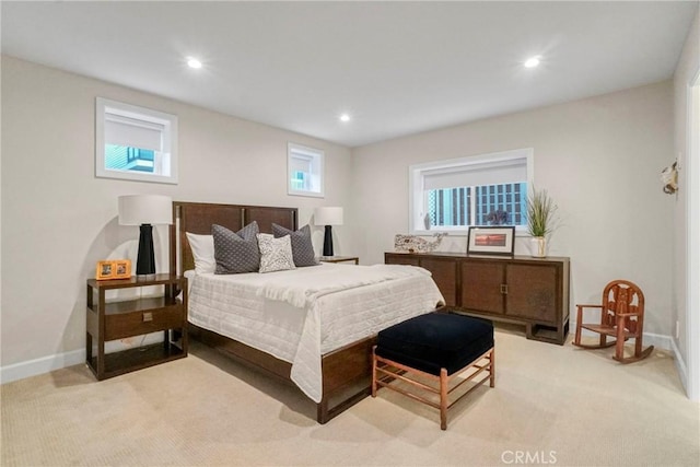 bedroom with recessed lighting, light colored carpet, and baseboards