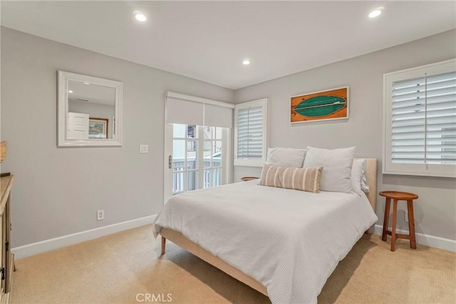 bedroom with recessed lighting, baseboards, and light carpet