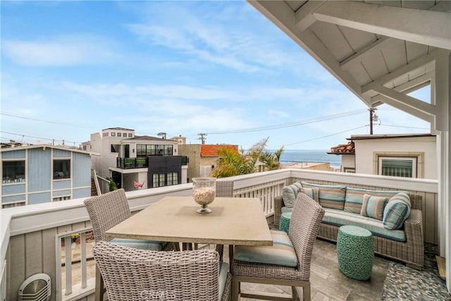 balcony featuring a water view