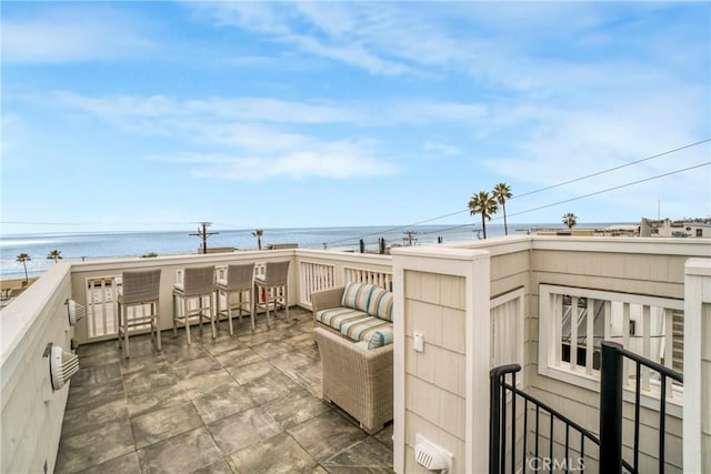 view of patio with a water view