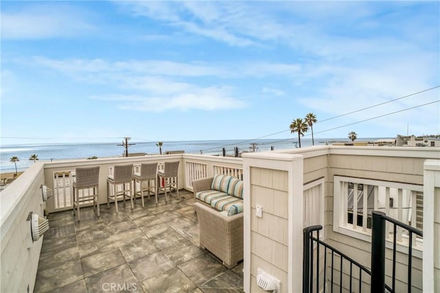 view of patio featuring a water view