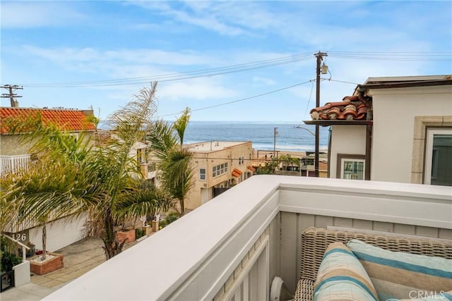 balcony featuring a water view