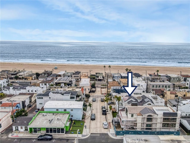 bird's eye view with a water view and a view of the beach