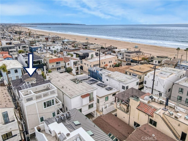 bird's eye view featuring a view of the beach and a water view