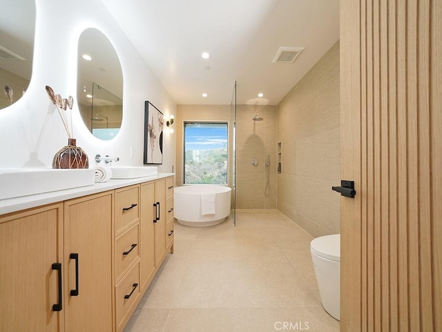 full bathroom with vanity, separate shower and tub, tile patterned floors, and toilet