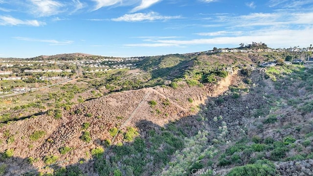 drone / aerial view featuring a mountain view