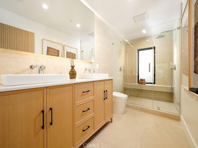 bathroom with vanity, an enclosed shower, tile patterned floors, and toilet