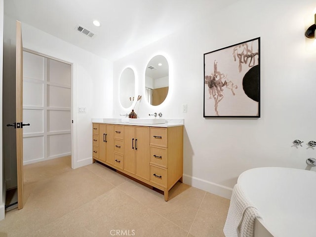 bathroom featuring vanity and tile patterned flooring