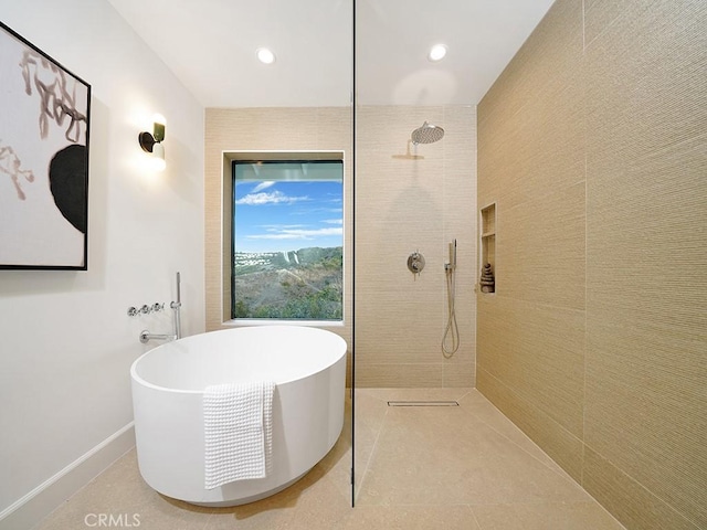 bathroom with plus walk in shower and tile patterned flooring