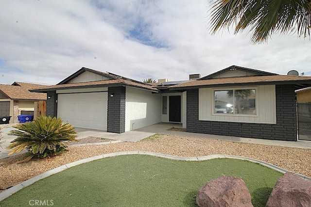 ranch-style home featuring a garage