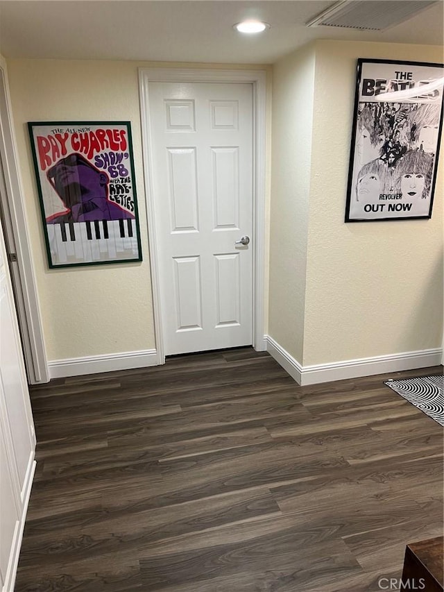 hall featuring dark wood-type flooring