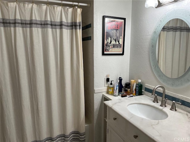 bathroom with vanity and shower / bath combination with curtain