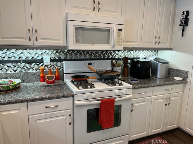 kitchen featuring dark wood-type flooring, white appliances, tasteful backsplash, and white cabinets