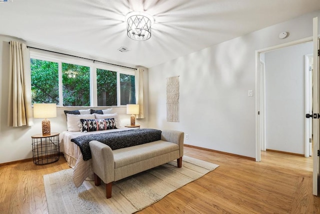 bedroom with light hardwood / wood-style flooring