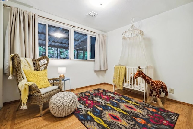 living area with hardwood / wood-style floors