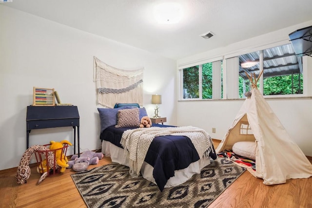 bedroom featuring hardwood / wood-style flooring