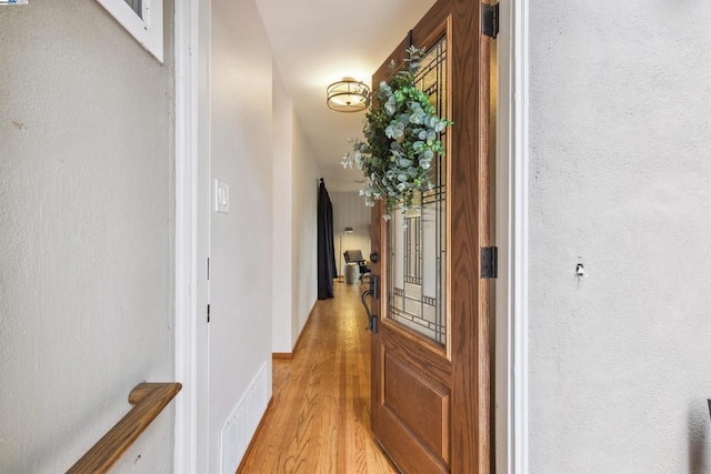 hall featuring light hardwood / wood-style floors